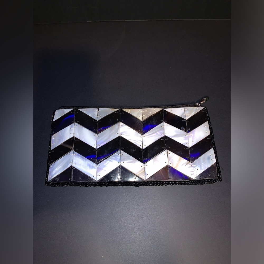 Mad, by design. Black and White shelled clutch. Used.